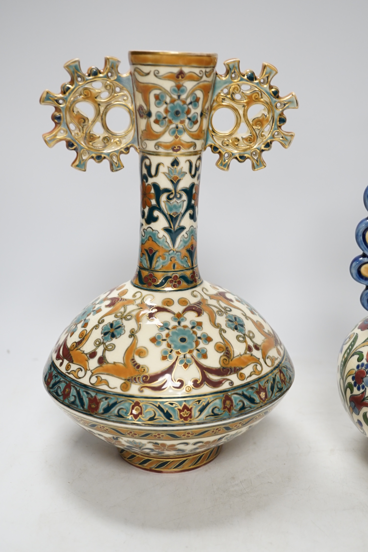 Two Hungarian Zsolnay vases, each with pierced decoration, largest 28cm high